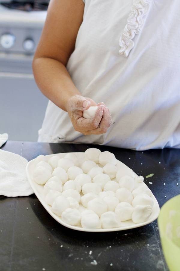 Coconut and sugar coated Filipino palitaw on a tray.