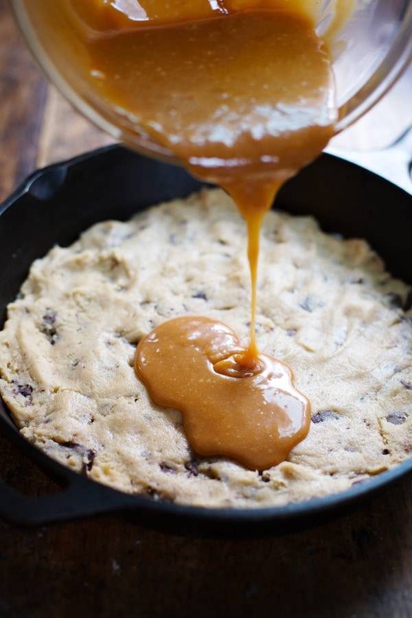 Deep dish chocolate chip cookie with caramel drizzle.