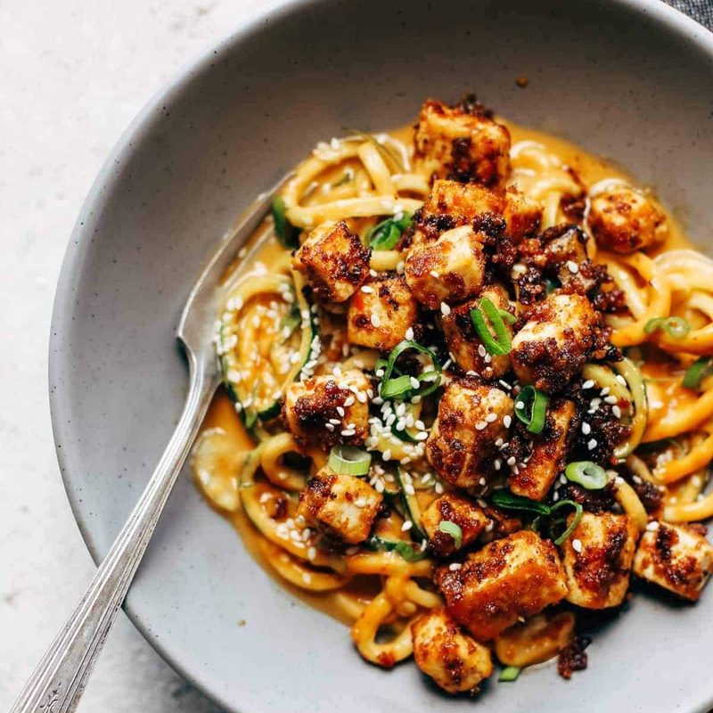 Spicy Sesame Zoodles with Crispy Tofu in bowl.
