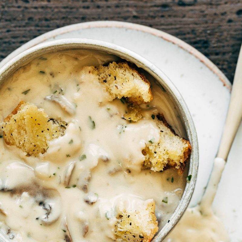 Cream of Mushroom Soup with croutons in a bowl.