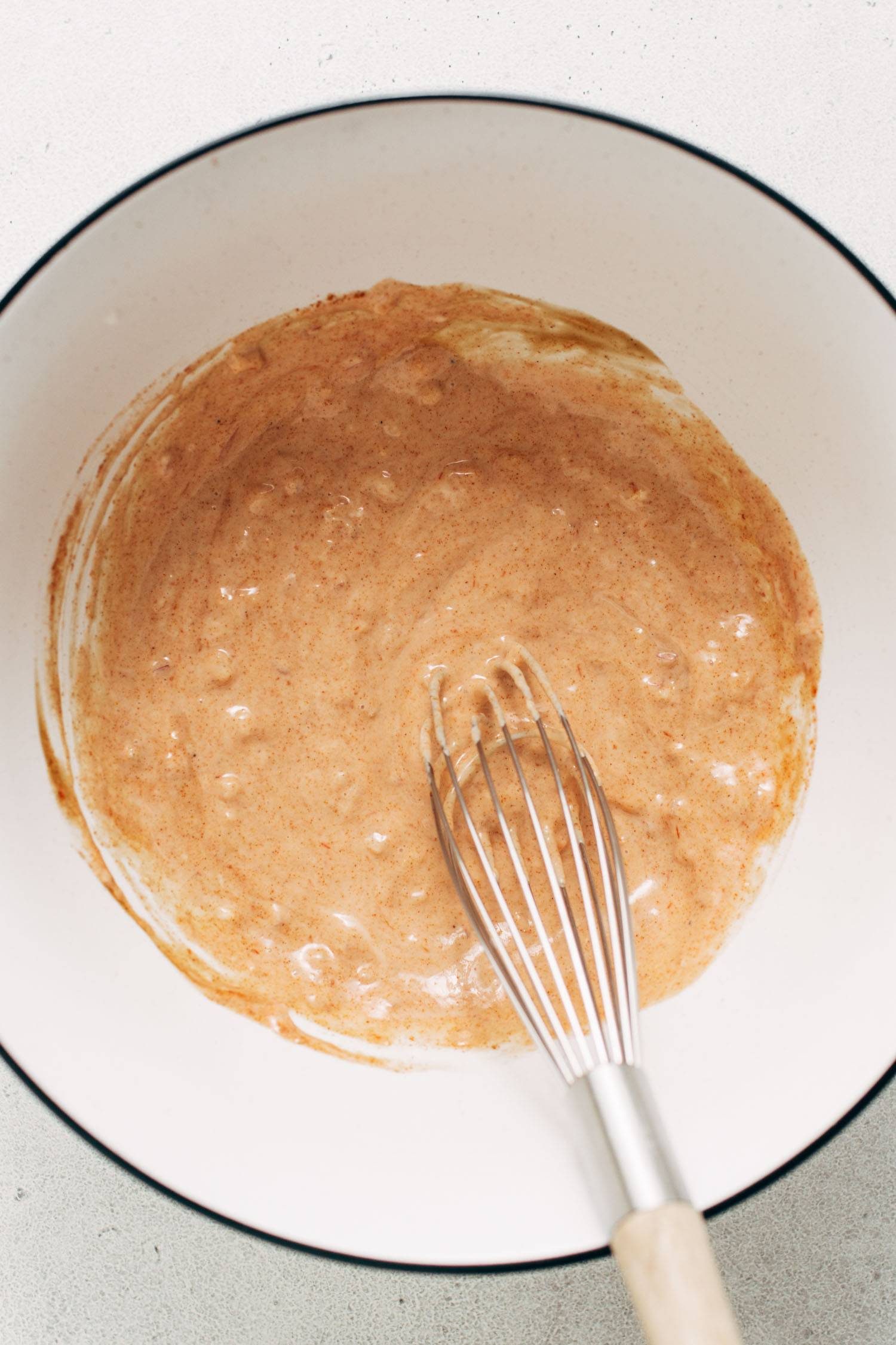 House sauce whisked up in a bowl.