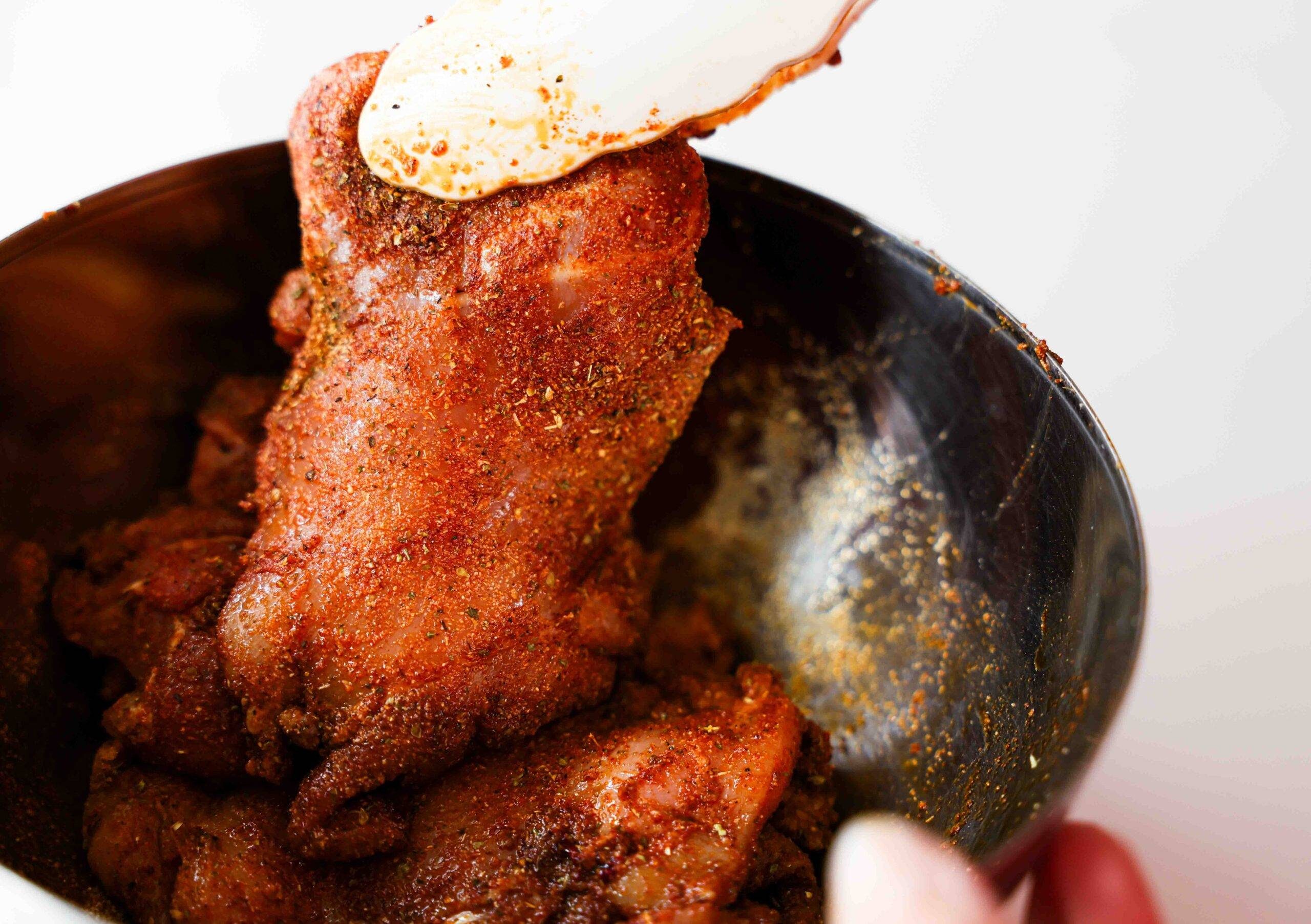 Coating the chicken in spices