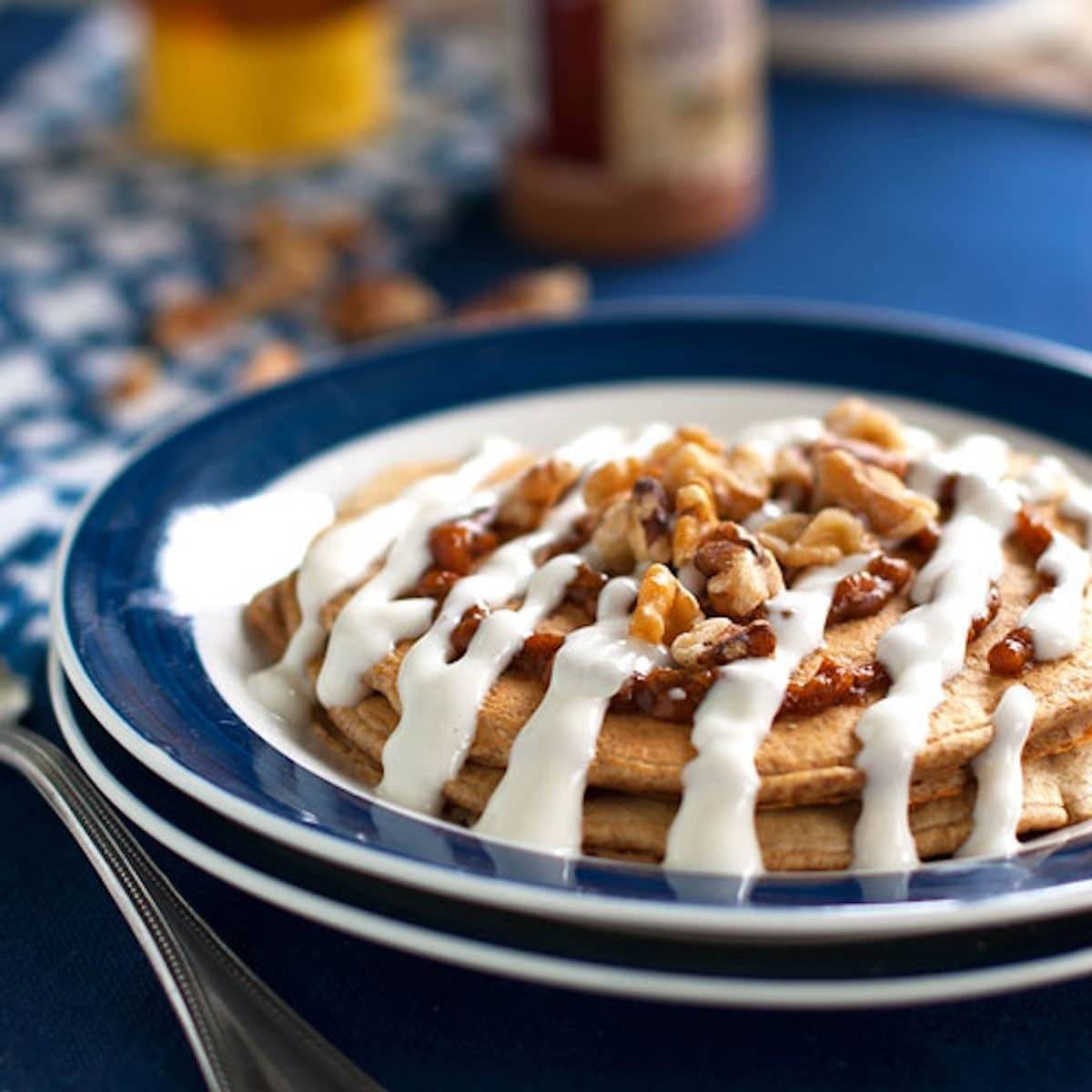 Cinnamon roll pancakes with a Greek yogurt frosting.