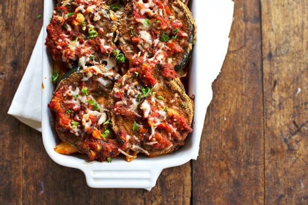 Baked Zucchini Parmesan in a white baking dish.