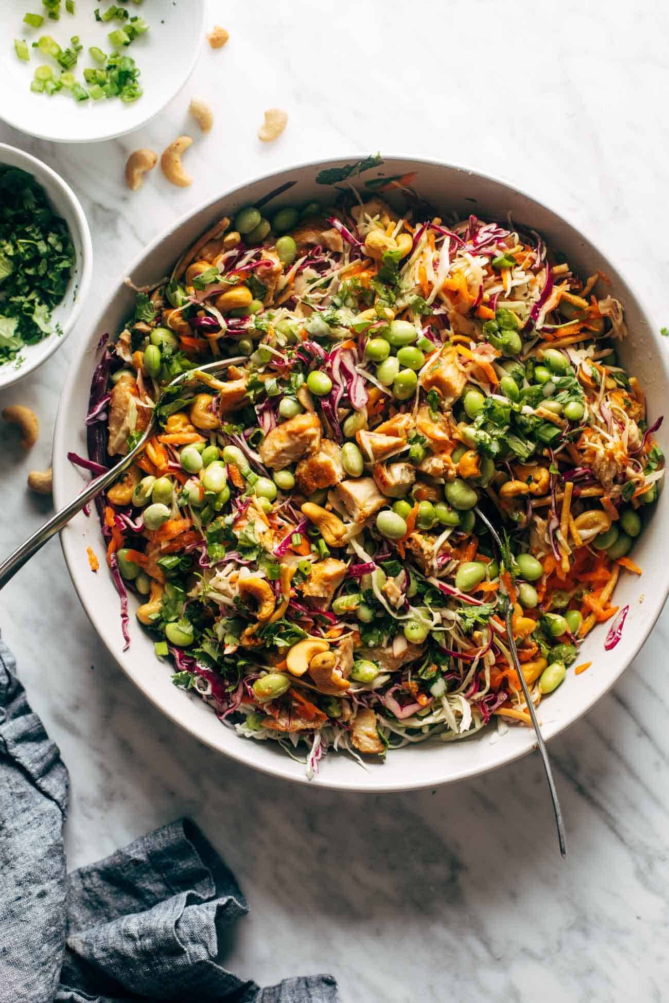 Cashew Crunch Salad in a bowl with a spoon.