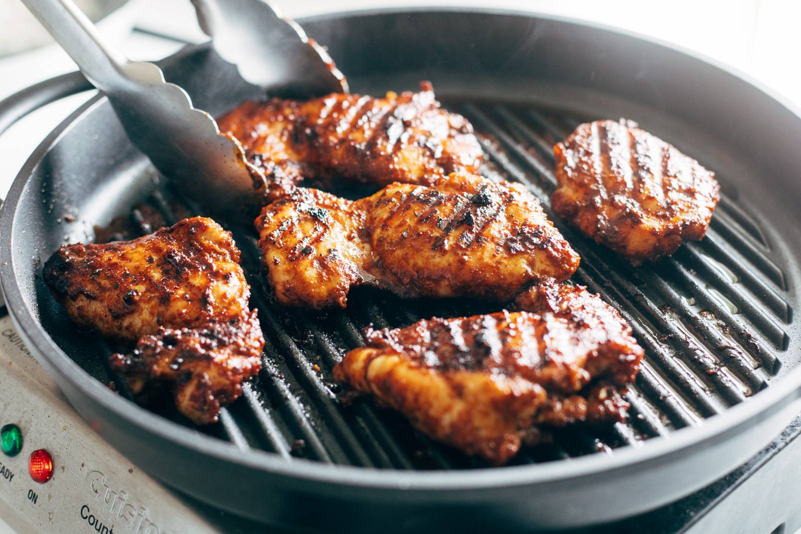 Grilling chicken in a grill pan.