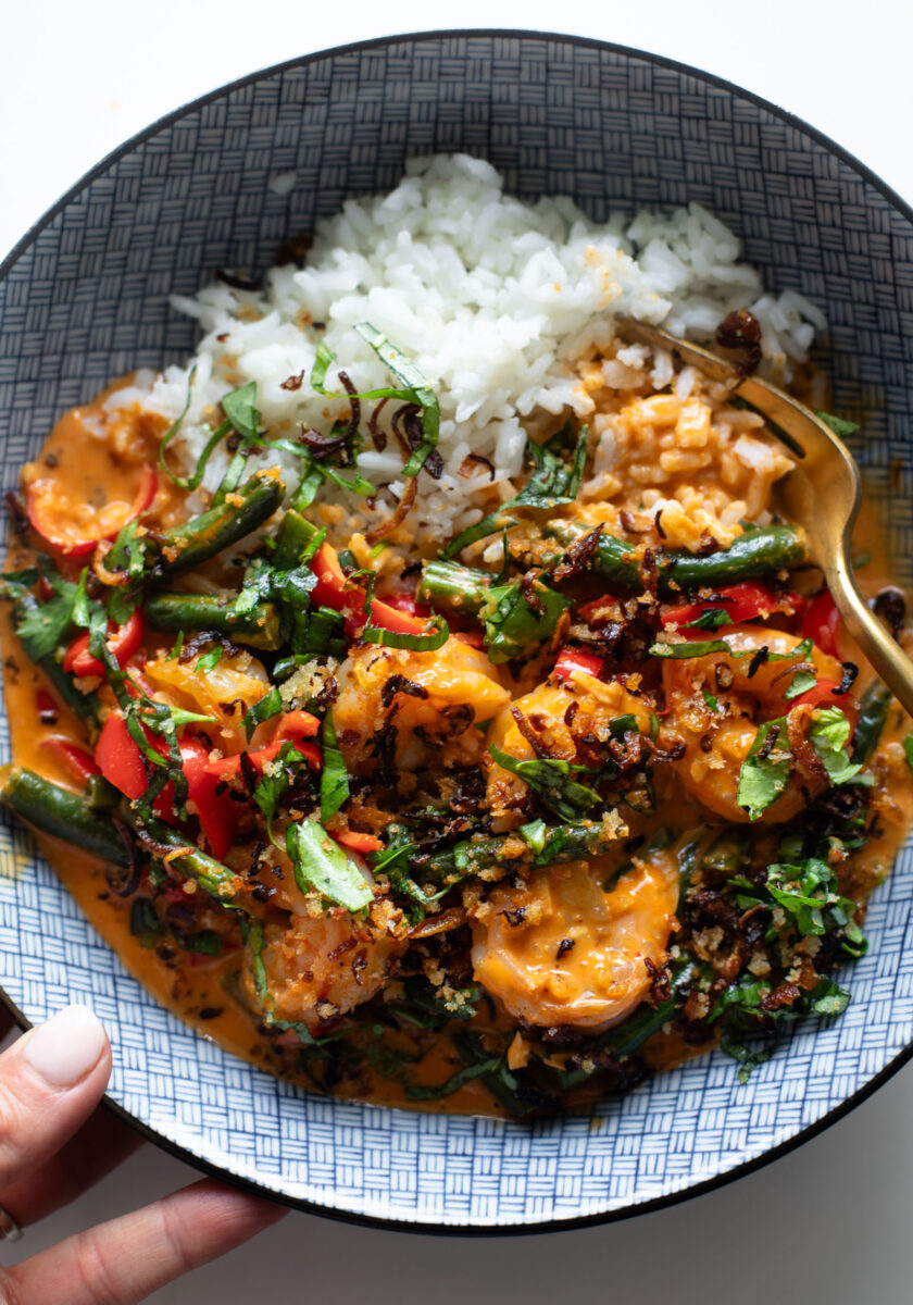 Shrimp curry in a bowl with rice.