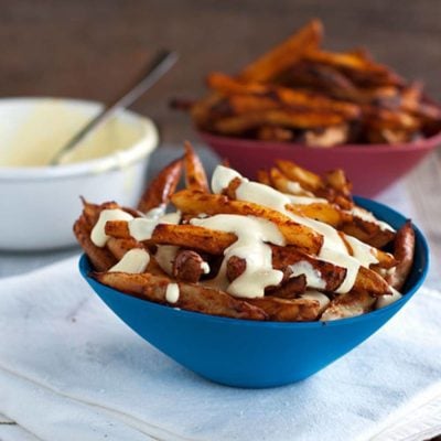 A picture of Baked Spicy Fries with Garlic Cheese Sauce