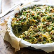Sausage Potato Pie in a dish with parchment paper.